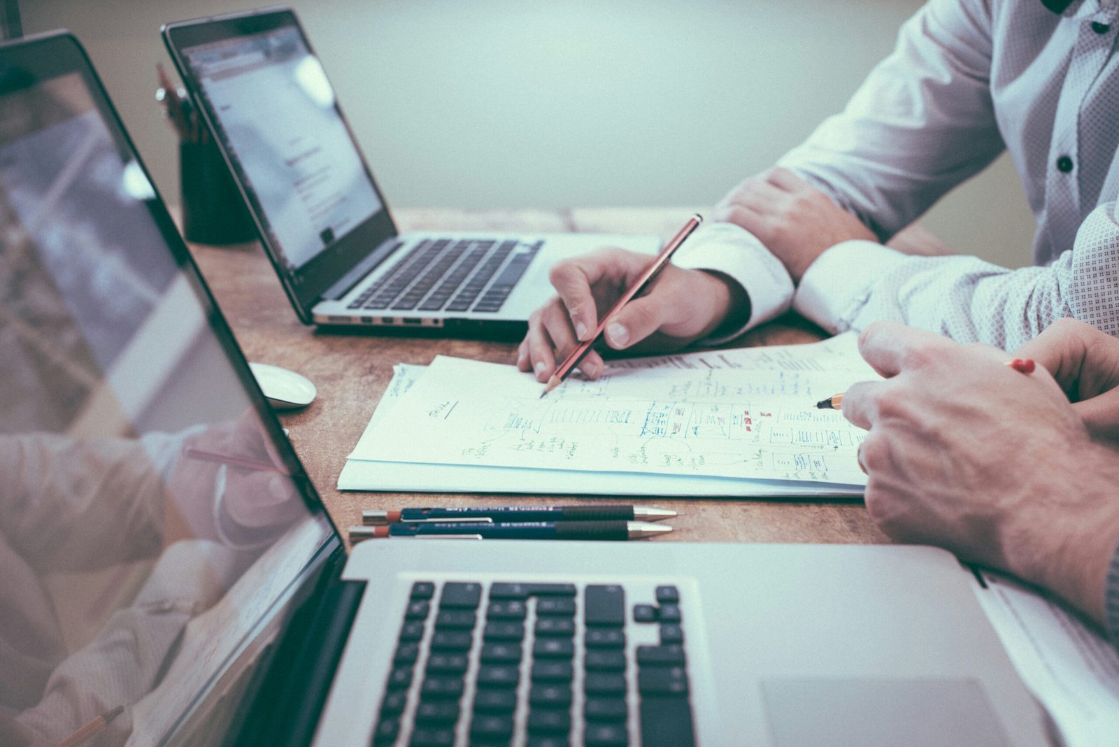 Understanding The Differences Between Cma And Cpa In Accounting Person Holding Pencil Near Laptop Computer